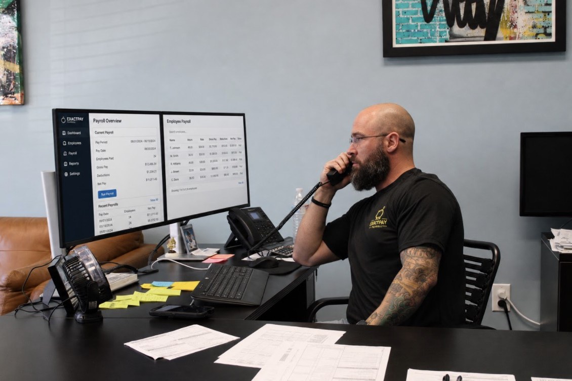 Craig Force at his desk running payroll in the Exactpay Payroll office